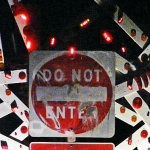 Do Not Enter • Installation and Performance with 40 Minute Sound Loop, Repurposed Street Sign, Painted Wood Shards with Flashing Bicycle lights and Reflectors, 115 x 160 x 48 inches (292.1 x 406.4 x 121.92 cm)