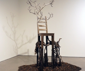 Deception • Full Left View • 2017 • Mixed Media Black Walnut Branch, Found  Chair, Acrylic Paint, Sumac Roots and Faux Roots, Black Walnuts, Potting Soil • 112 inches x 70 inches x 60 inches (285 cm x 178 cm x 122 cm)