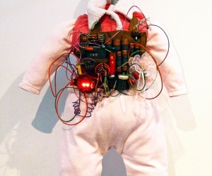 Pinkie, Infant Suicide Bomber Vest Model #2010-2011TL • Mixed Media, R.A.M.S.E.S. Recycled-Assembled-Miscellaneous-Surplus-Engineered-Scrap, 24 X 18 x 12 inches (60.96 x 45.72 x 30.48 cm)