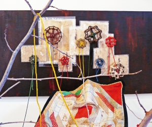 The Visit (Detail 2) • Installation, Acrylic and Tar on Panel with Painted Canvases in Plexiglas, Faucet Valves with Painted Strings, Piece of a Civil War Era Quilt, Dead Tree and Reflecting Pool, 80 x 72 x 60 inches (variable tree size) (203.2 x 182.88 x 152.4 cm)