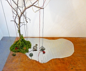 The Visit (Detail 4) • Installation, Acrylic and Tar on Panel with Painted Canvases in Plexiglas, Faucet Valves with Painted Strings, Piece of a Civil War Era Quilt, Dead Tree and Reflecting Pool, 80 x 72 x 60 inches (variable tree size) (203.2 x 182.88 x 152.4 cm)